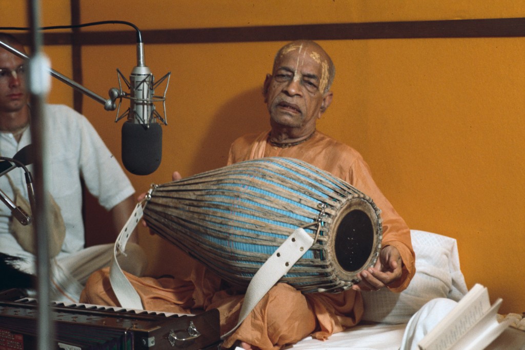 Srila Prabhupada playing mridanga in the studio